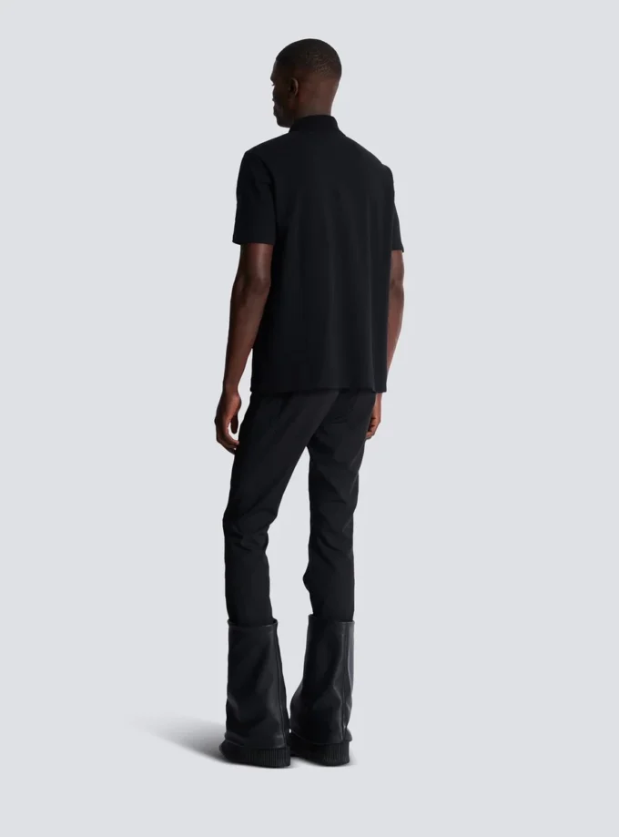 Cotton polo shirt with leather Balmain Couture label Cotton polo shirt with leather Balmain Couture label