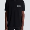 Cotton polo shirt with leather Balmain Couture label Cotton polo shirt with leather Balmain Couture label