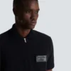 Cotton polo shirt with leather Balmain Couture label Cotton polo shirt with leather Balmain Couture label