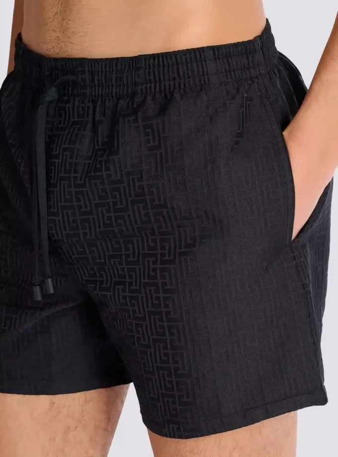 Monogrammed swim shorts