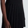 Pleated glitter knit skirt
