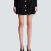 Short pleated skirt in plaid knit Short pleated skirt in plaid knit