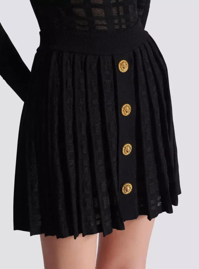 Short pleated skirt in plaid knit Short pleated skirt in plaid knit