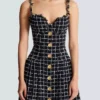 Tweed dress with chain straps