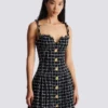 Tweed dress with chain straps